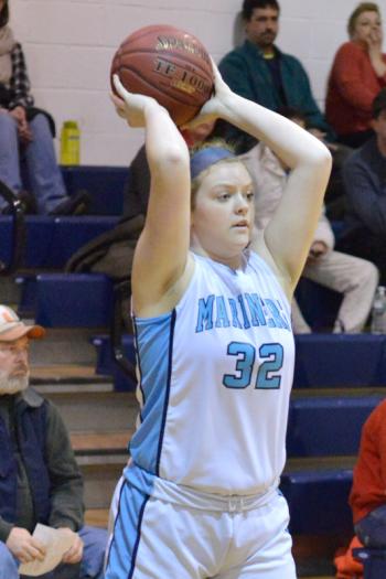Oceanside’s Alexis Mazurek looks to pass the ball out of the corner. (Photo by Ron Hawkes)