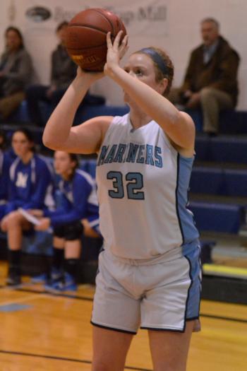 Oceanside’s Alexis Mazurek scores her two points before getting injured and leaving the game. (Photo by Ron Hawkes)