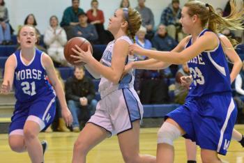 Oceanside’s Haley Montgomery races to the basket with Morse’s Noa Sreden on her heels. (Photo by Ron Hawkes)