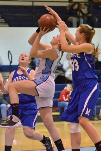 Morse’s Noa Sreden makes a beautiful block on the shot, but was called for the foul despite the perfect blocked shot. (Photo by Ron Hawkes)