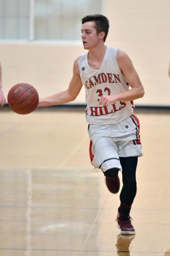 Camden Hills Dalton Oakes takes the ball to the basket. (Photo by Ron Hawkes)