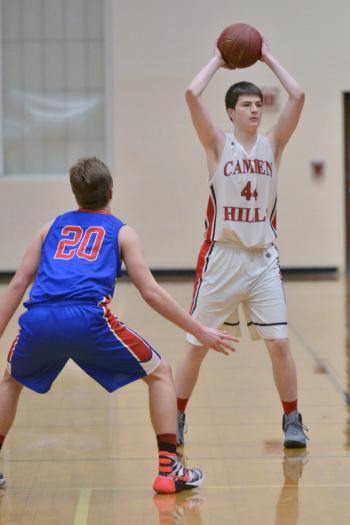 Camden’s Daniel Peabody, right, makes the pass as Mt. Ararat’s Jacob Steinman plays loose defense on the big man. (Photo by Ron Hawkes)
