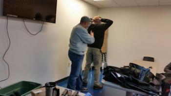 Sgt. Lance Mitchell demonstrates how to frisk a person to check for weapons. (Photo by Sarah Shepherd)