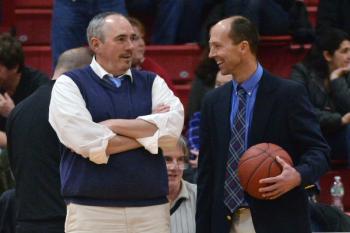 Camden Hills coach Jeff Hart, left, talks with Mt. Ararat coach Steve Cox who played for Hart in high school at Camden-Rockport High School. This was the first meeting of the two as coaches with Mt. Ararat getting the 59-49 win. (Photo by Ron Hawkes)