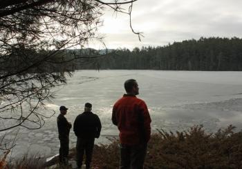 At 7:30 a.m. Tuesday, Maine game wardens and Lincolnville Fire Chief Ben Hazen gather back at Wiley Neck, where divers would eventually locate the body of Trueman Moore. (Photo by Holly S. Edwards)