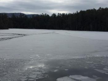 Footprints in the ice show the path Trueman Moore traveled as he walked from Fernald’s Neck, far right and in the background, toward Wiley Neck, foreground left, where he went through thin ice. (Photo by Holly Edwards)
