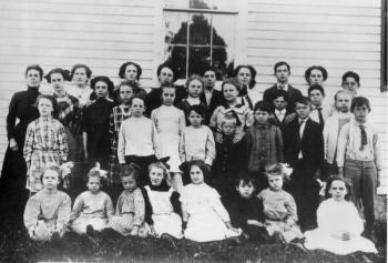 The Centre School in 1911. In the front row Marjorie Calderwood is third from the left, fifth from left is Doris Heal, and third from the left in the third row is Hester Calderwood. Teacher Sadie Knight, far left fourth row, was responsible for thirty-three pupils in the one room school; all eight grades are represented here. The school building was pulled across the road by some 150 townspeople in 201 and rebuilt as the Lincolnville Community Library. (Photo courtesy of the Lincolnville Historical Society) centre school