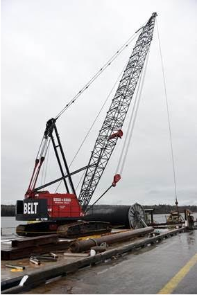A crane from Reed and Reed is used to lay a new submarine cable to Islesboro. The cable ensures more reliable service to the island community in the future. It also includes a fiber-optic line that will support the community’s efforts to install a broadband network to serve island homes and businesses.