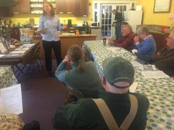 Event-goers listen to Jennifer Albee of ReVision Energy speak at Morris Farm in Wiscasset on April 2. SUSAN JOHNS/Wiscasset Newspaper