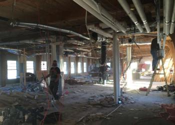 Demolishing the inside of the Knox Mill top floor, February 2016, 20-plus years after it had been renovated as corporate offices. Next incarnation: apartments. (Photo by Lynda Clancy)