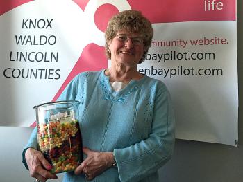 Jackie Harjula of Thomaston had the best guess of how many Jelly Belly jelly beans were in the jar at the PenBayPilot.com booth at the April 13 PenBay Chamber Business. She not only took home 3,312 sweet beans, she won a beautiful sterling silver urchin and diamond pendant necklace, courtesy of Russell’s of Camden Fine Jewelry. (Photo by Holly S. Edwards)