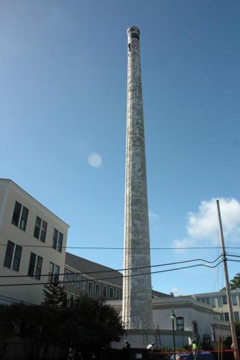 The Knox Mill is located along Mechanic Street, and the smokestack can be seen in its entirety from Washington Street. This photo is from September 2014, when work to restore and strengthen the tower got underway. (Photo by Holly S. Edwards)