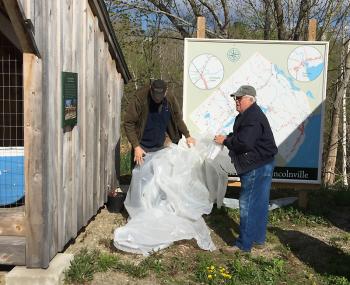 Rosey Gerry and Cecil Dennison uncover the historical home map. (Photo by Holly S. Edwards)