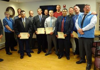 Members of the first STRIVE Northern New England graduating class pose with their certificates. (Photo by Erica Thoms)
