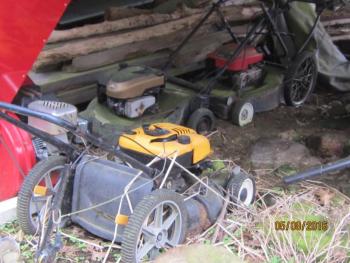 What is it about men and saving this old junk and calling it “parts mowers”? A lawn mower cemetery is more like it.
Photo by Diane O’Brien lawn mowers