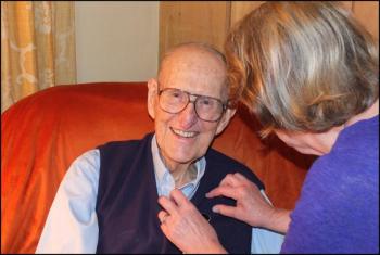 Carol Blyberg adds a pin to her father, Maurice “Butch” Granville’s lapel to mark the occasion of the Boston Post Cane. (Photos by Chris Wolf)
