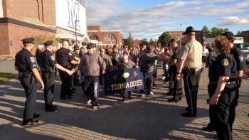 The law enforcement welcoming line for the Special Olympic athletes. (Photo by Justin Hills)