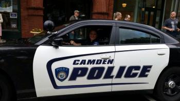 Brook Hartshorn, Camden Police officer, drives the lead car for the torch run. (Photo by Sarah Shepherd)