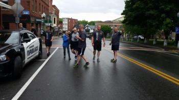The runners took off for the annual Law Enforcement Torch Run with Graham Wiley carrying the torch. (Photo by Sarah Shepherd)