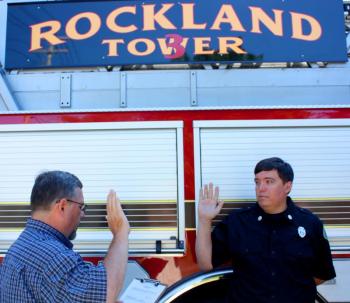 Rockland City Clerk Stuart Sylvester swears in new city paramedic Bill Pendleton July 20. (Photo by Holly S. Edwards)