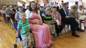 The Bollinger family in the first and second rows at the Change of Command Ceremony. (Photo by Sarah Shepherd)