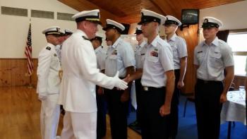 Outgoing Commander Officer John Huard and incoming Commander Michael Bollinger inspect the crew during the Change of Command Ceremony. (Photo by Sarah Shepherd)