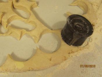 A special cutter or even a soup can works to cut out the biscuits cutting