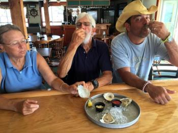 Three oyster lovers at the upstairs bar of The World is Mine Oyster. SUZI THAYER/Boothbay Register