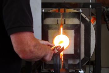 The ‘glory hole’ furnace is the working furnace, in which blown glass is reheated between steps in the process. (Photo by Holly S. Edwards)