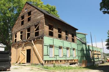 The building today has been torn down to the bare bones, but after the renovation, every bit of saved trim will be put back on so that the building looks just like it in its heyday. (Photo by Holly S. Edwards)