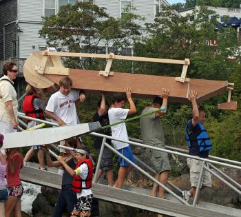 A unique design that relies on crew members to row and move the paddle, with a rudder used for steering around corners. (Photo by Holly S. Edwards)