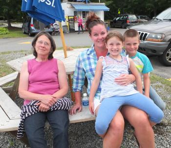 Elaine Neville, Claire Neville, Brooklyn Rollins and Michael Rollins, all from Camden, enjoy the music. (Photo by Chris Wolf)