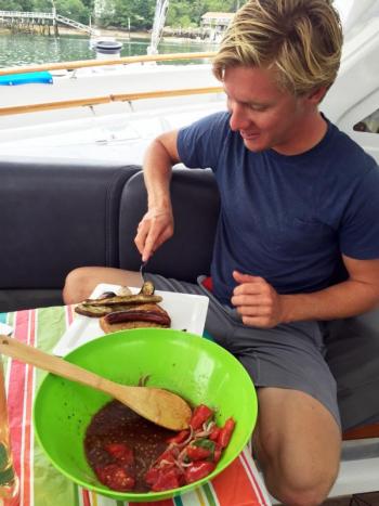 First Mate Evan Duffy enjoys some grub aboard the Impossible Dream. SUZI THAYER/Boothbay Register