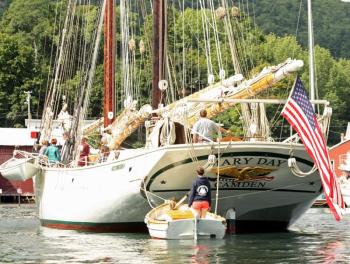 Getting back to business, Capt. Barry King and his crew bring the schooner Mary Day into her berth at the head of Camden Harbor. (Photo by Holly S. Edwards)