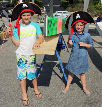 The Rollins siblings and their boat, Pesky Pirates, before the race. (Photo by Holly S. Edwards)