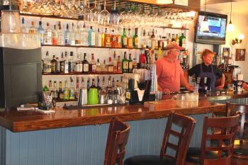 Corinna and Greg behind the bar