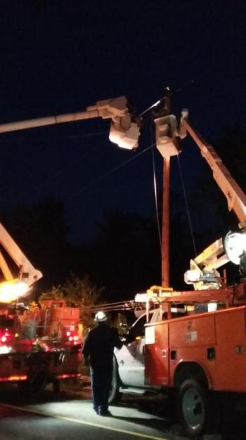 Utility crews work at the scene. Courtesy of Edgecomb Assistant Fire Chief John Potter
