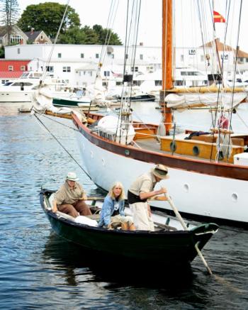 Susan Manning at the helm, her husband, Sam, at the stern and Meg Maiden seated center in the Manning’s dory. (Photo by Holly S. Edwards)