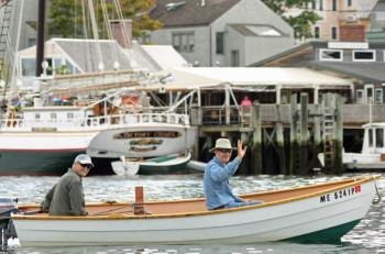 Charles Gale and Bob Walther have for years helped at Camden Windjammer Festival, towing in the small boats for the schooners. (Photo by Holly S. Edwards)