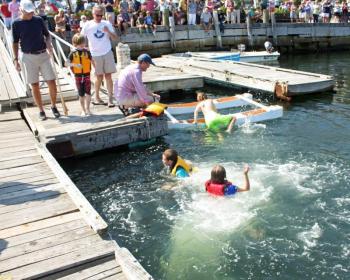 Après race jumps into the harbor! (Photo by Holly S. Edwards)