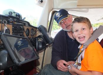 Ken Otmann, pilot, and JJ prepare for a flying lesson.