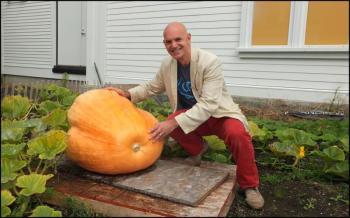 David Troup of the Farnsworth shows off his pumpkin pride as he poses with his homegrown gourd. (Photos by Chris Wolf)