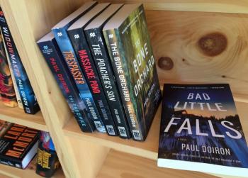 A collection of series books by Maine author Paul Doiron.