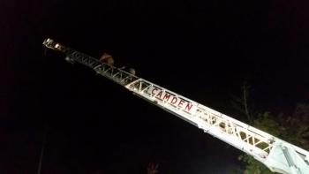 David Heath climbs the ladder with Todd Anderson of the Camden Fire Department. (Photo by Sarah Shepherd)