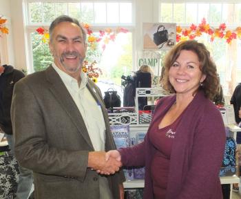 State Senator Dave Miramant congratulates Flowers by Hoboken owner Lisa Farley.