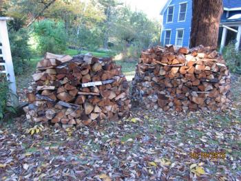 Two of this year’s round woodpiles.
Photo by Diane O’Brien woodpiles