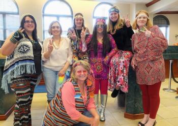 It was a hippie theme at the downtown branch of Camden National Bank. Love children from the 60s are Jillian Reid, Wendi Ashey, Amy Pierce, Jessica Humphrey, Jodi Landrith, Regina Whitney and Tamara Hooper. If you go there, be sure to wear some flowers in your hair. (Photos by Chris Wolf)