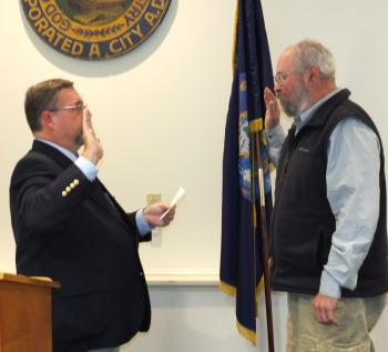 Stuart Sylvester swears in Ed Glaser as Rockland’s newest city councilor,