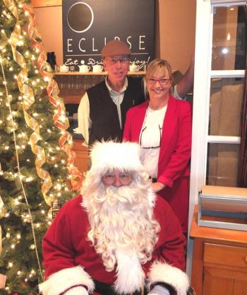 Gordon Page, Kathleen LaBree and Santa pose before breakfast. (Photo by Chris Wolf)