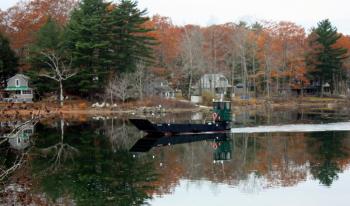 Casey Leonard at the helm of M/V ‘Lady Crane’ Tuesday, Nov. 15, in Megunticook Lake in Camden. (Photo by Holly S. Edwards)
